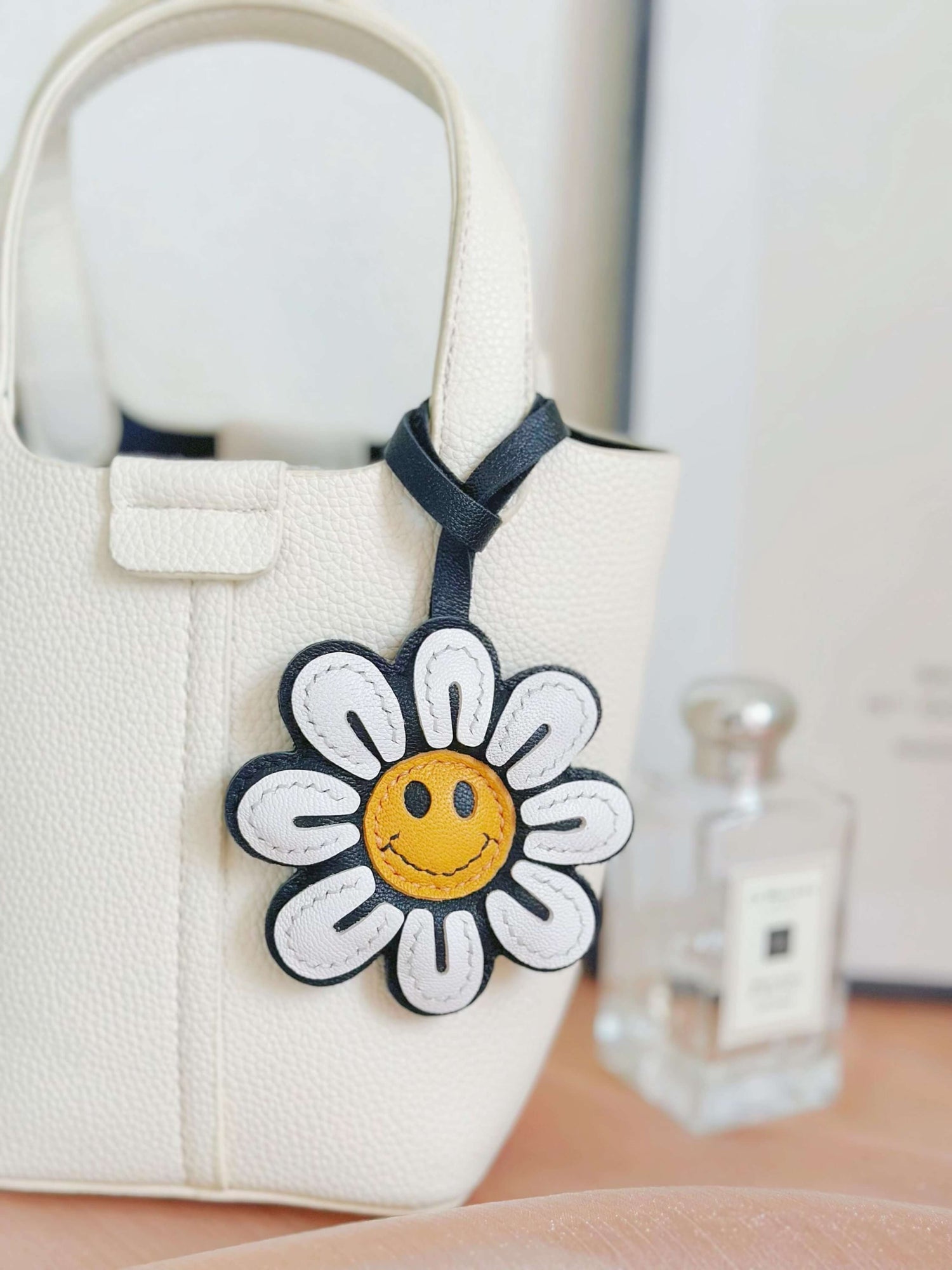 Ciondolo per borsa con fiore felice